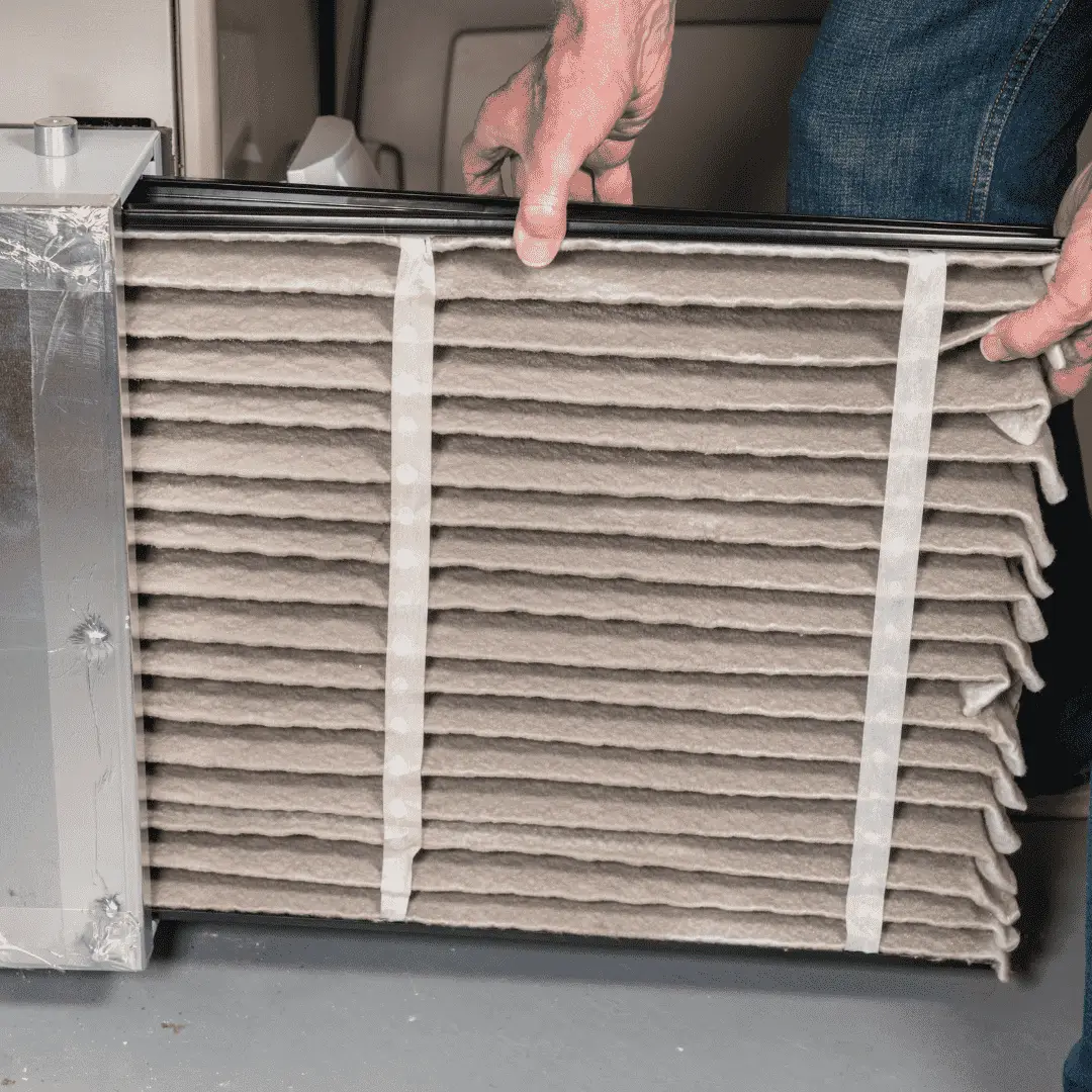 Hawana technician replacing a dirty air filter to ensure furnace efficiency.
