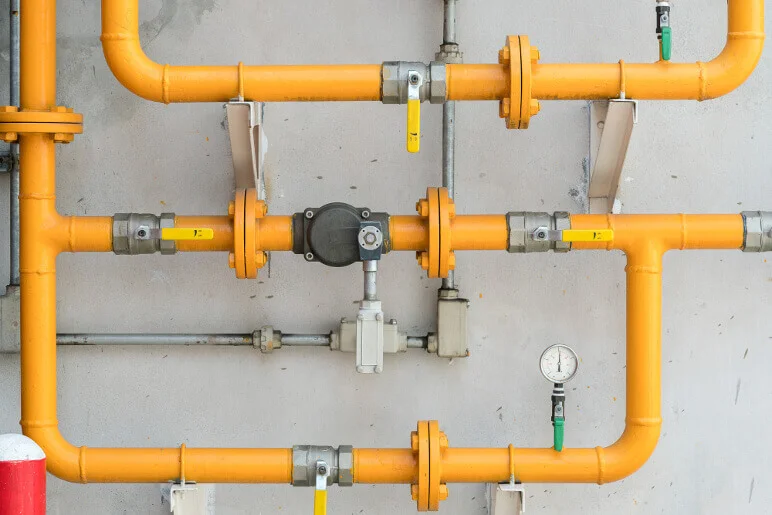 Newly installed commercial gas line, painted yellow for safety show by Hawana HVAC Solutions.